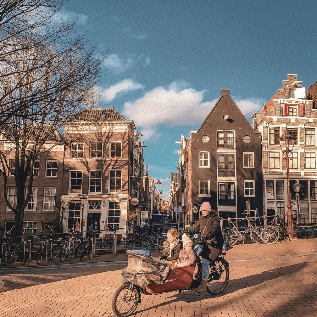 Mother cycling in Amsterdam
